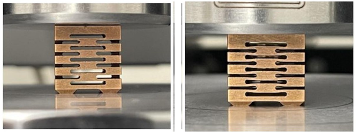 Two photographs of a beryllium-copper prototype spring between the platens of an Instron testing frame, unloaded and under clamping force